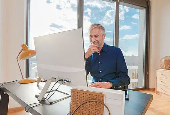 A man is working at a desk